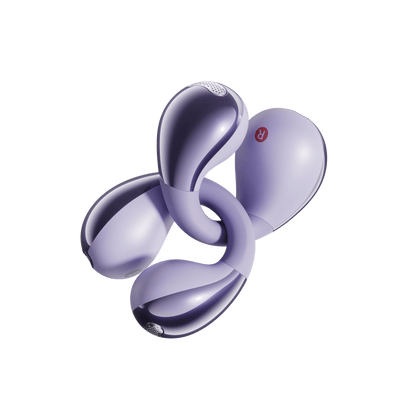 Purple QCY Crossky C30 earbuds arranged in artistic spiral pattern showing L/R indicators on light background.