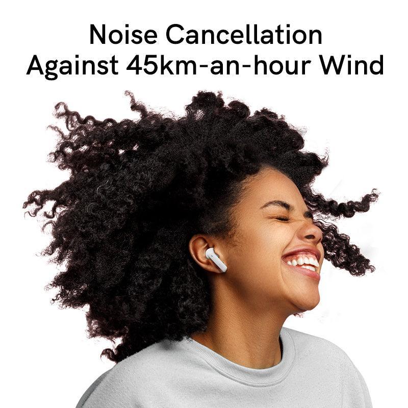 White QCY MeloBuds ANC earbuds with noise cancellation against 45km/h wind, shown on model enjoying music.