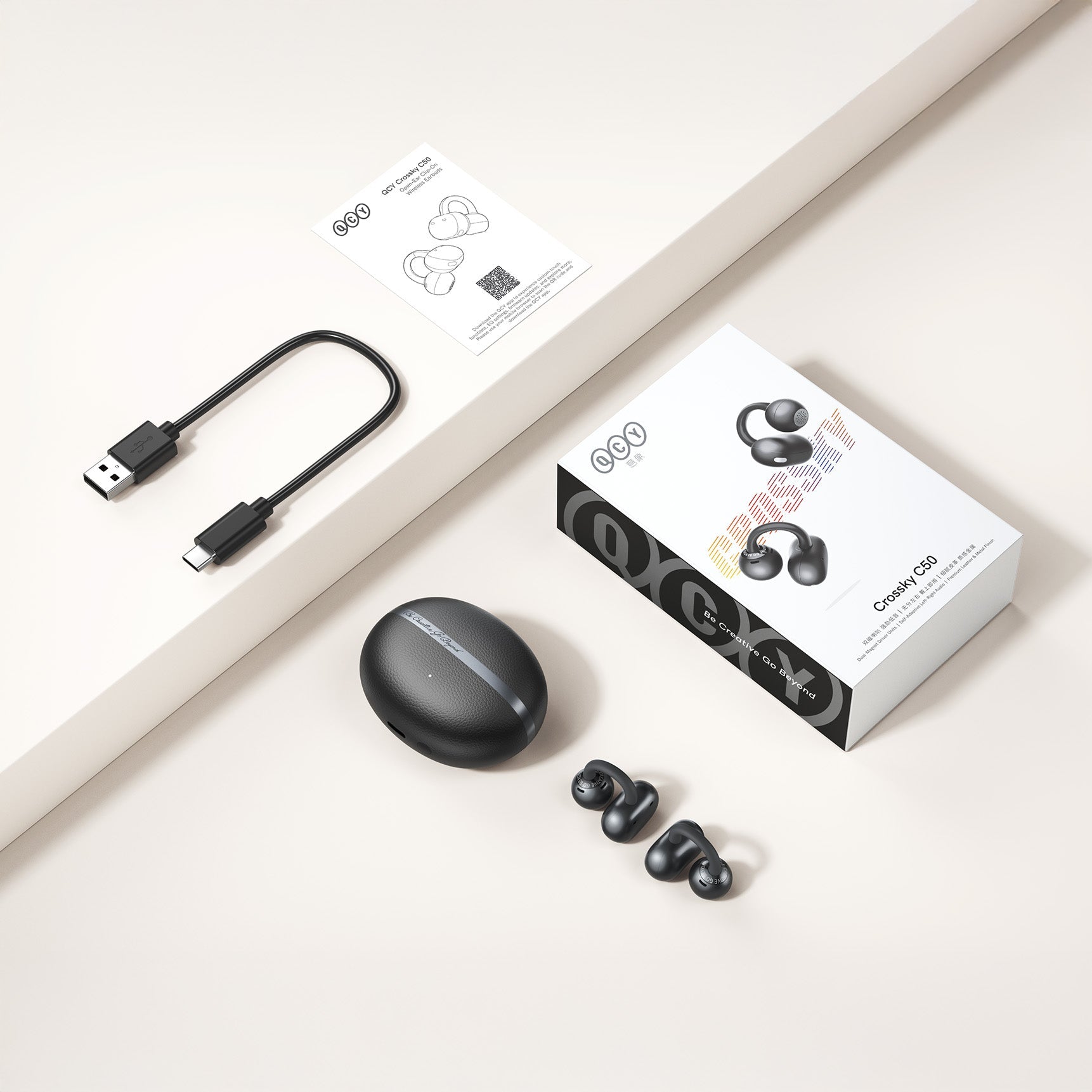 Auricolari True Wireless QCY Crossky C50 con custodia di ricarica, USB-C e manuale.