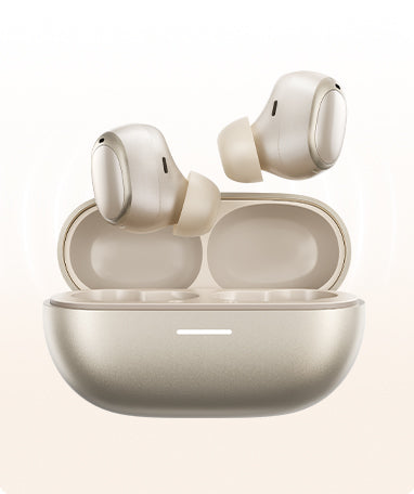 Auricolari wireless grigi in una stazione di ricarica aperta, design moderno con superficie lucida.