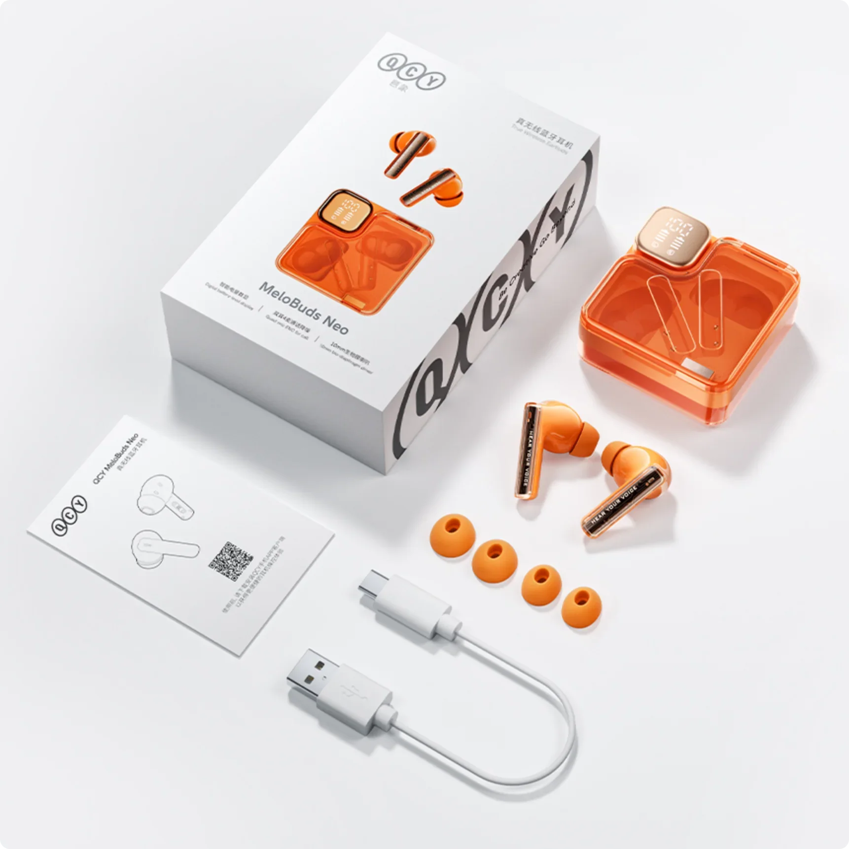 QCY MeloBuds Neo: cuffie true wireless arancioni con custodia di ricarica, cavo USB-C e auricolari di ricambio.