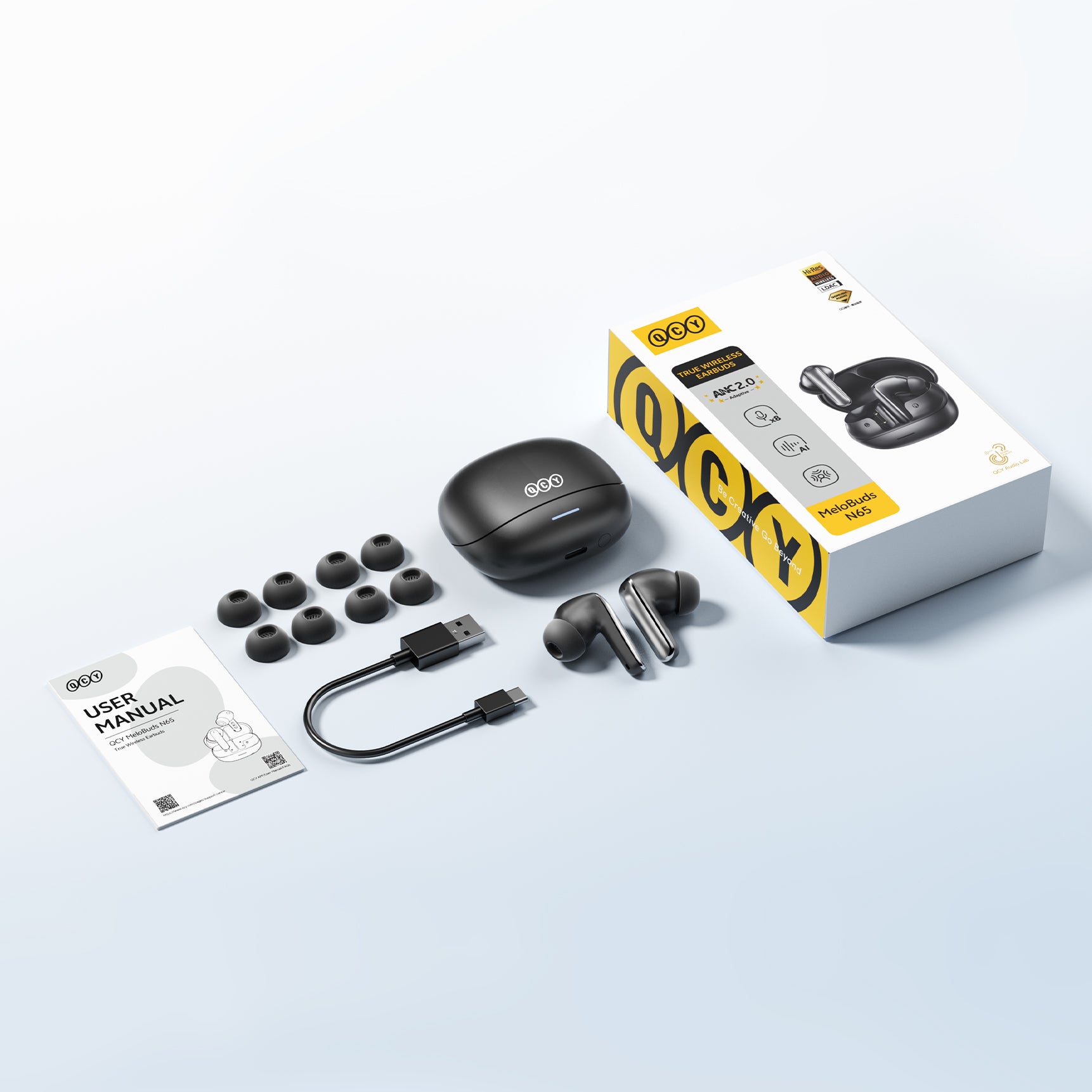 Cuffie True Wireless QCY MeloBuds N65 con ANC, cavo di ricarica USB-C e auricolari di ricambio.